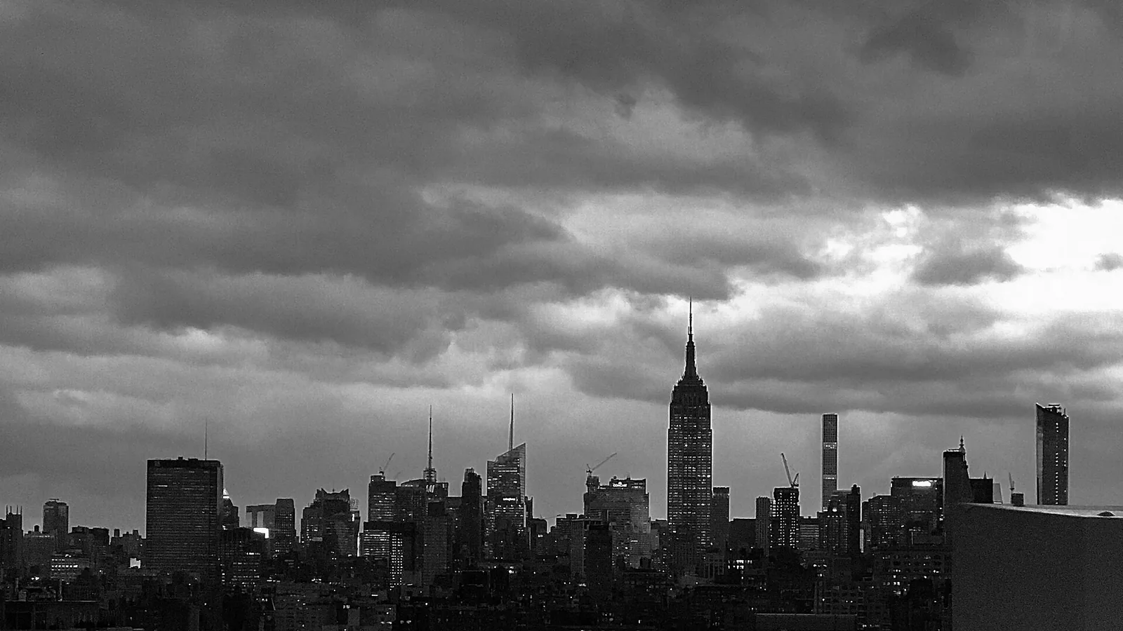 Manhattan skyline and the Empire State Building beneath heavy winter clouds