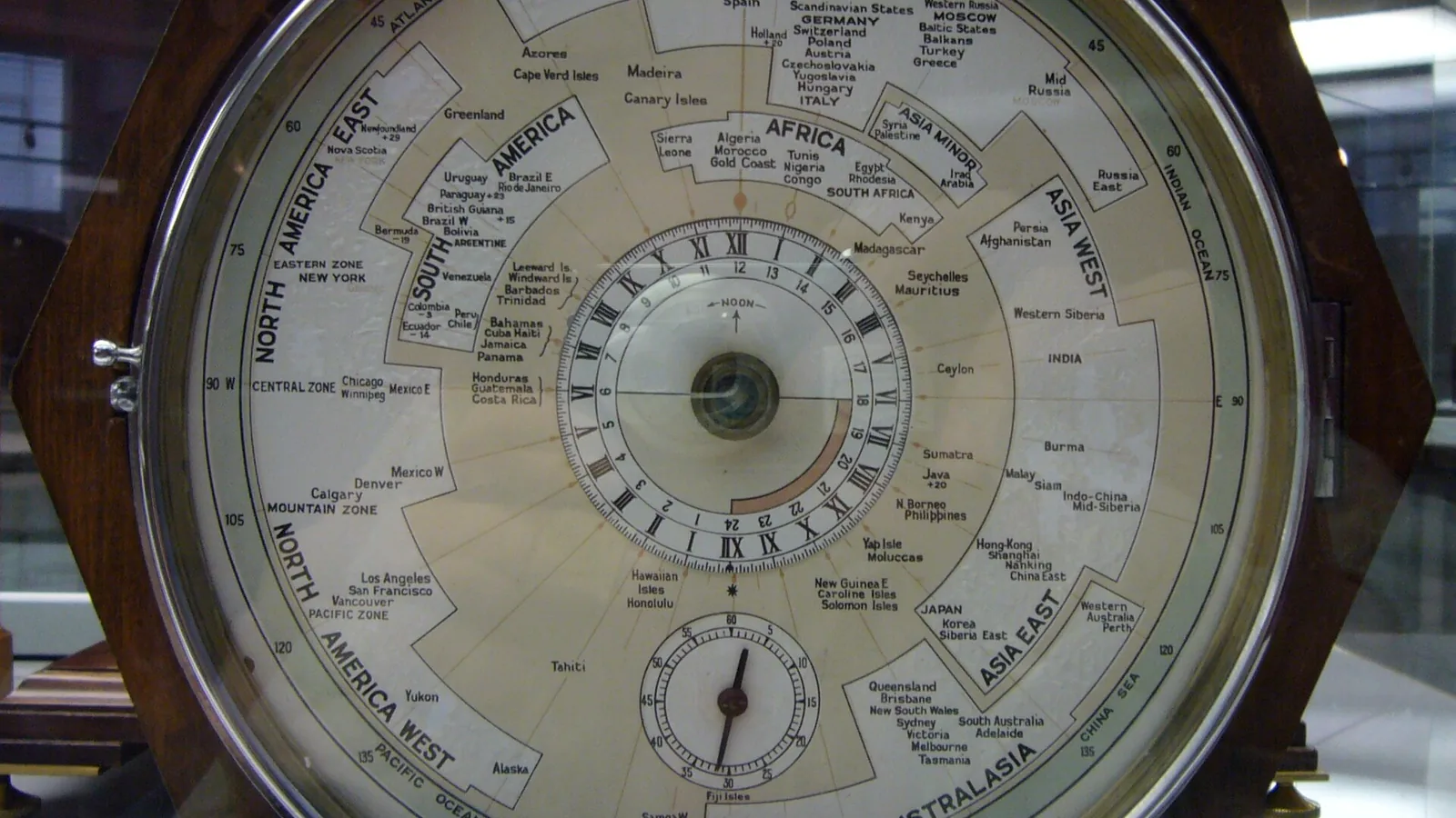 The historic Willis World Clock with a world map and time scales around its circular dial